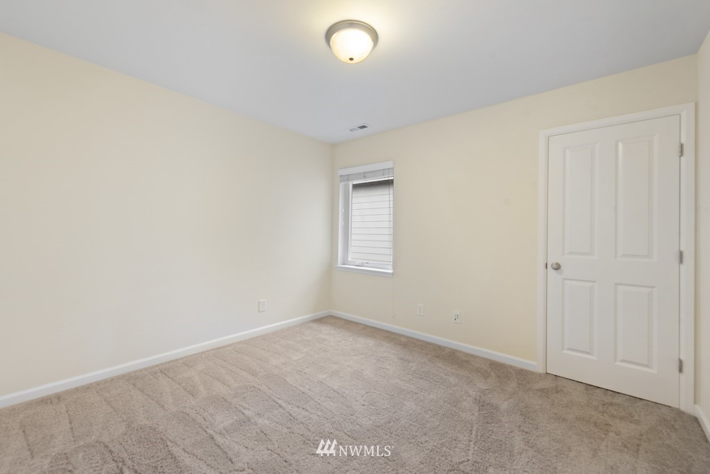 16232 Southeast 139th Court Renton, WA 98059 - Photo 13 of 23 a view of an empty room with a window