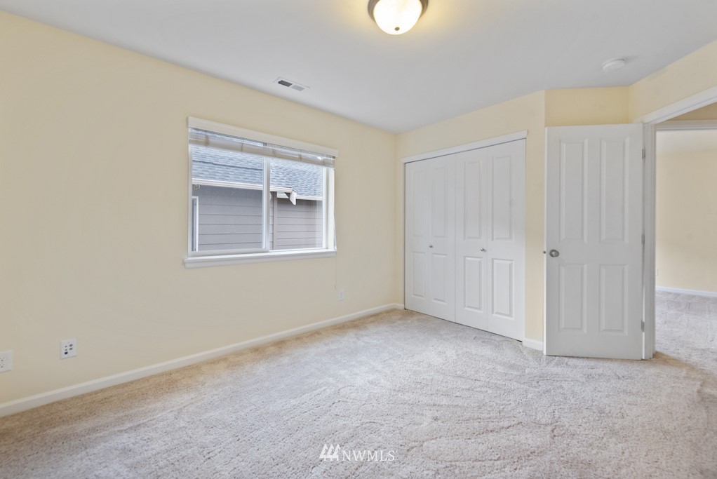 16232 Southeast 139th Court Renton, WA 98059 - Photo 14 of 23 a view of an empty room with a window