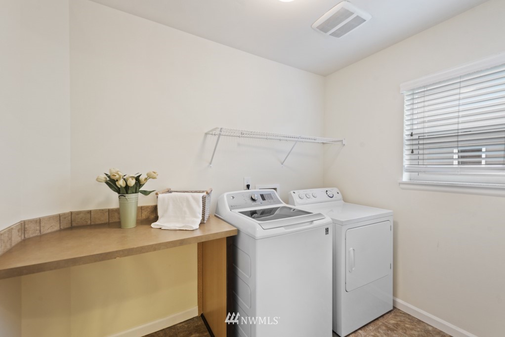 16232 Southeast 139th Court Renton, WA 98059 - Photo 19 of 23 a utility room with dryer and washer