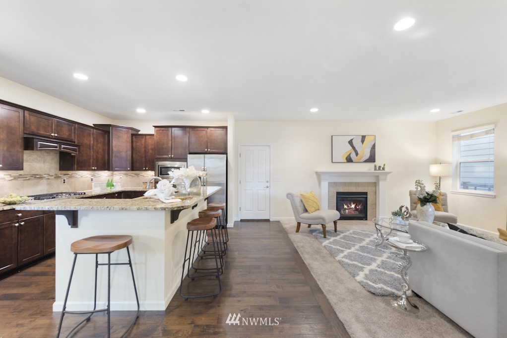 16232 Southeast 139th Court Renton, WA 98059 - Photo 2 of 23 a large kitchen with stainless steel appliances granite countertop a stove and a refrigerator