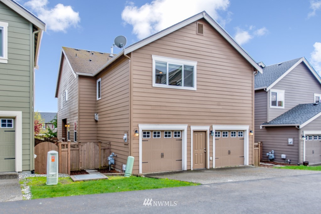 16232 Southeast 139th Court Renton, WA 98059 - Photo 21 of 23 a view of a house with a yard and a large tree