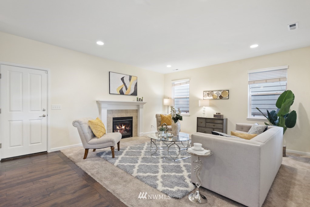 16232 Southeast 139th Court Renton, WA 98059 - Photo 3 of 23 a living room with furniture a fireplace and a potted plant