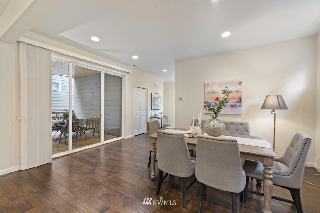 16232 Southeast 139th Court Renton, WA 98059 - Photo 4 of 23 a dining room with furniture wooden floor and a rug