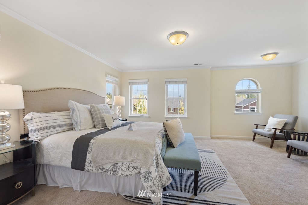16232 Southeast 139th Court Renton, WA 98059 - Photo 10 of 23 a bedroom with a bed and lamp