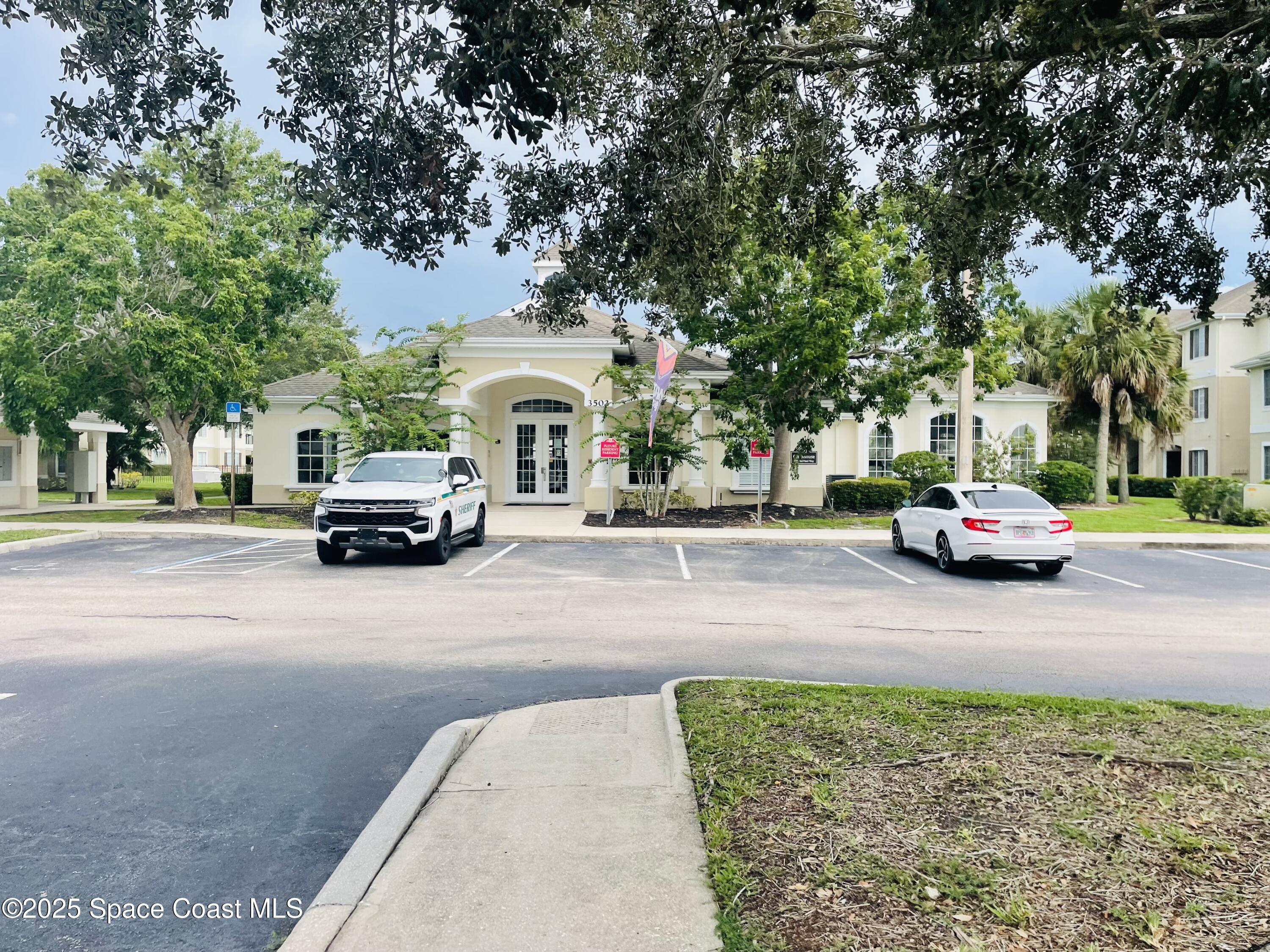 3501 D D'Avinci Way, Unit 1011 Melbourne, FL 32901 - Photo 15 of 19 a car parked on the side of a street