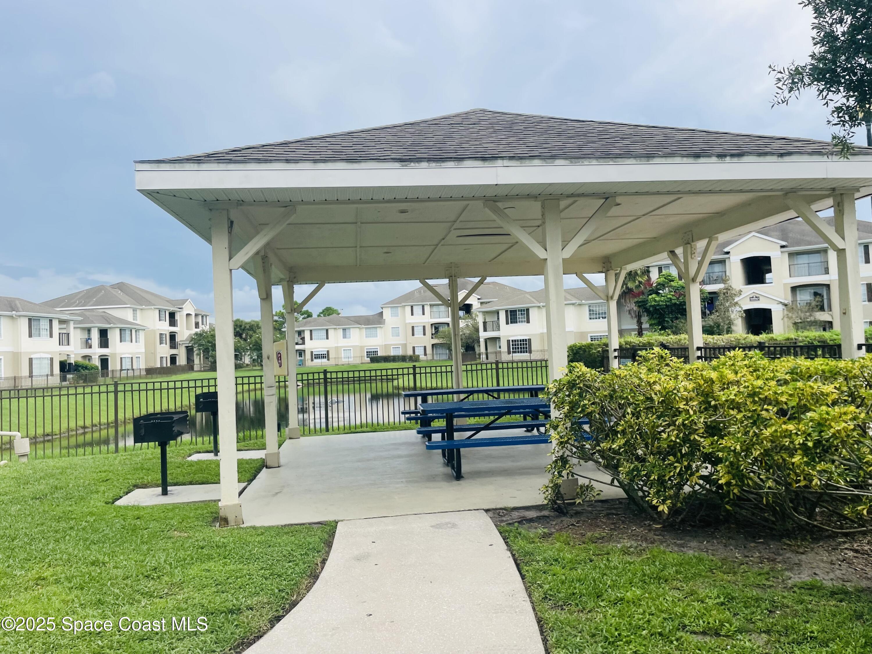3501 D D'Avinci Way, Unit 1011 Melbourne, FL 32901 - Photo 17 of 19 a house view with a outdoor space