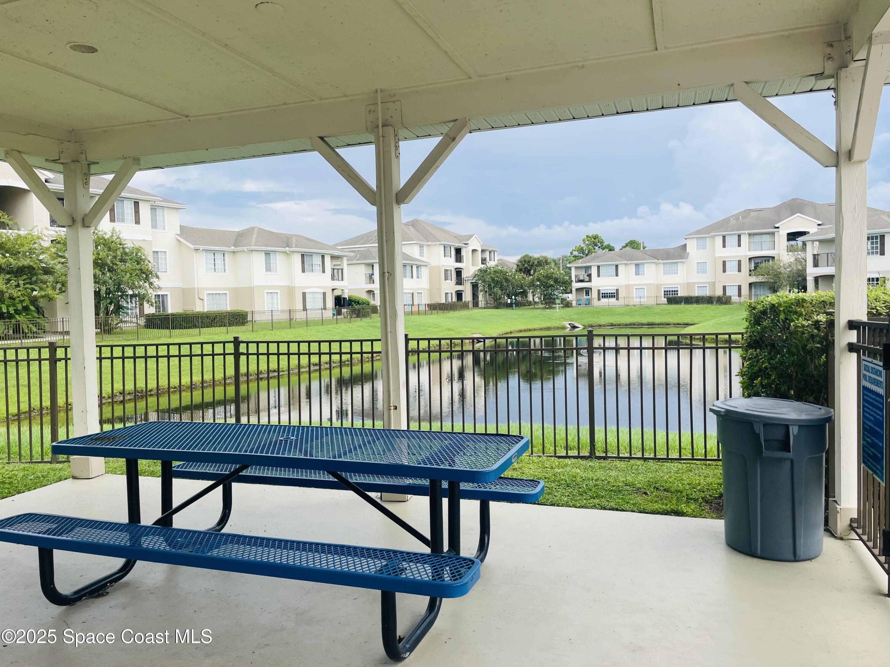 3501 D D'Avinci Way, Unit 1011 Melbourne, FL 32901 - Photo 19 of 19 a view of a chairs and table in the deck