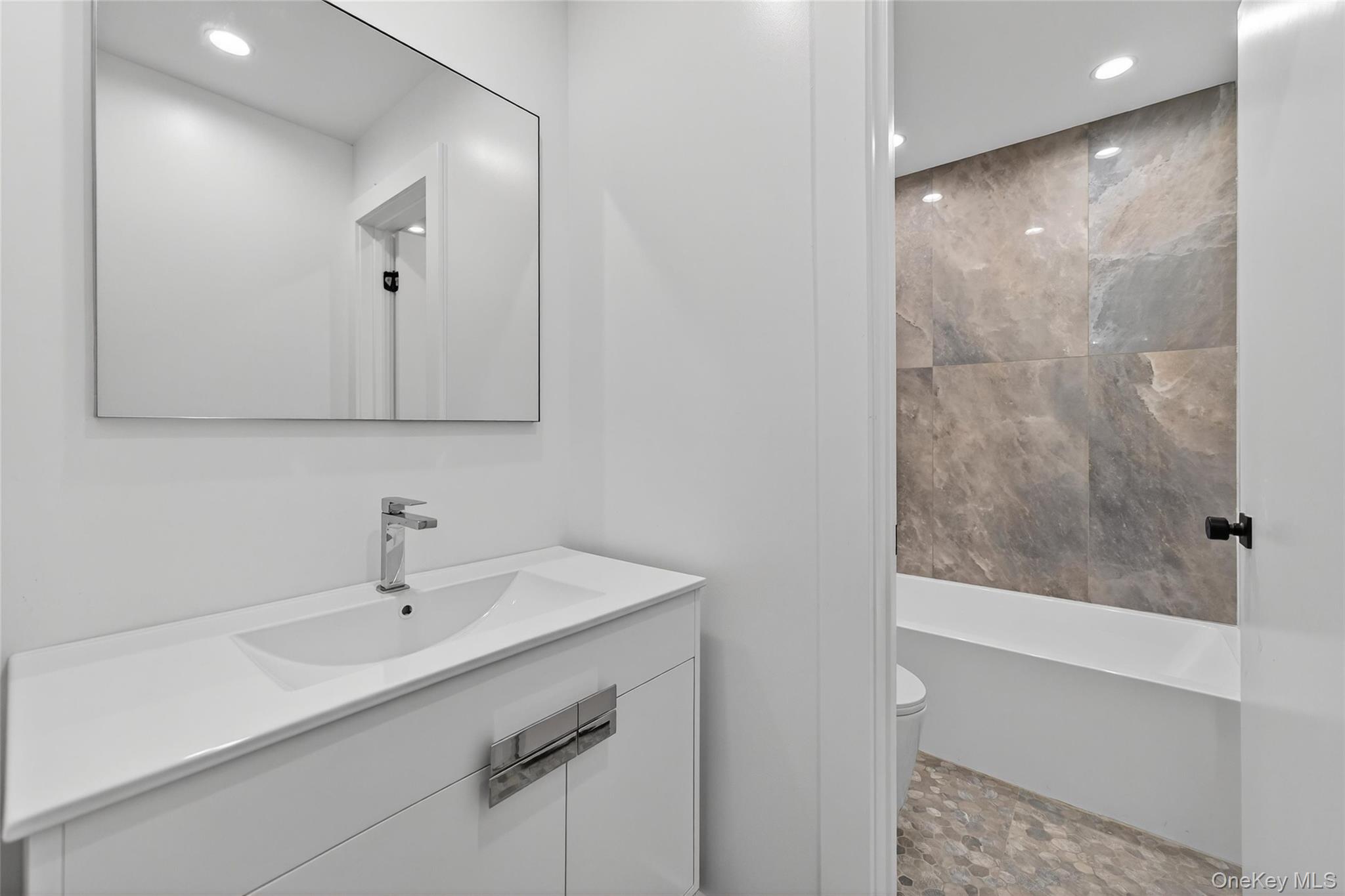 8 East Dillon Road, Unit 201 Monticello, NY 12701 - Photo 31 of 47 a bathroom with a sink and a mirror