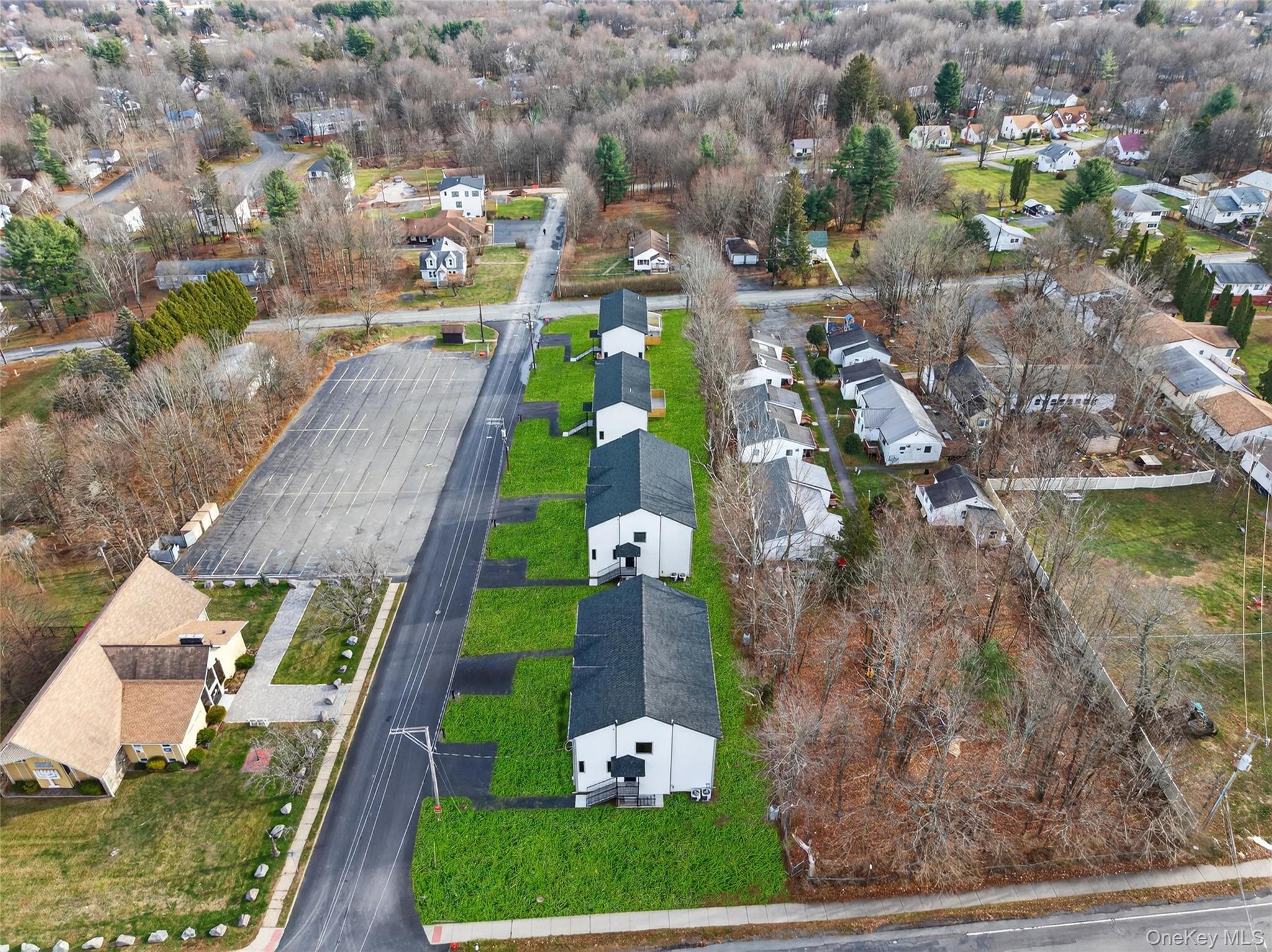 8 East Dillon Road, Unit 201 Monticello, NY 12701 - Photo 4 of 47 an aerial view of a house with a garden and trees