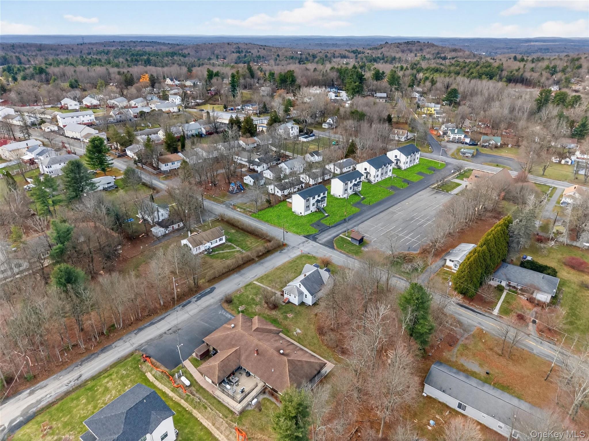 8 East Dillon Road, Unit 201 Monticello, NY 12701 - Photo 44 of 47 an aerial view of a city with mountains