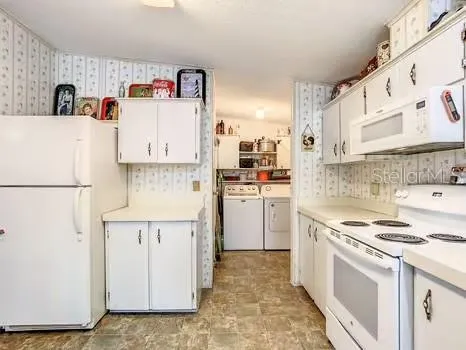 a work room with furniture and a window