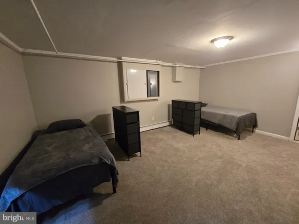 a bedroom with a bed and furniture