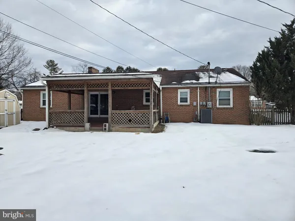 a view of a house with a snow in the yard