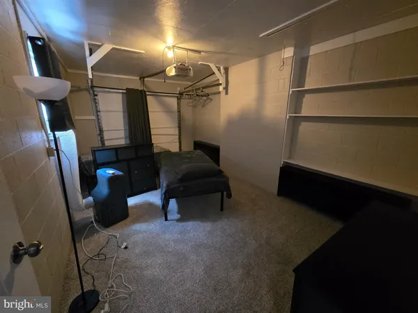a room with lots of appliances and furniture