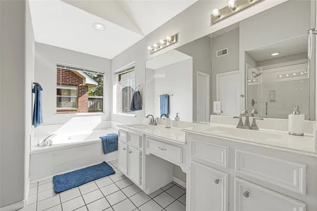 a bathroom with a shower and a glass door