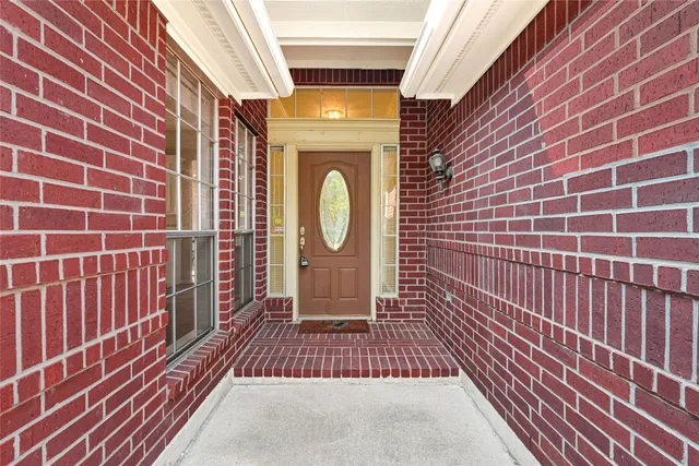 a view of a door with a door and wooden floor