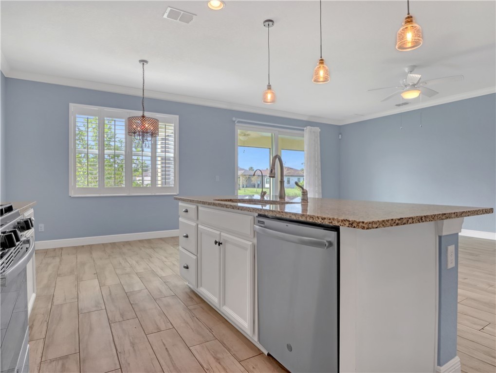 1756 Willows Square Vero Beach, FL 32966 - Photo 15 of 35 a view of a kitchen with a sink and wooden floor