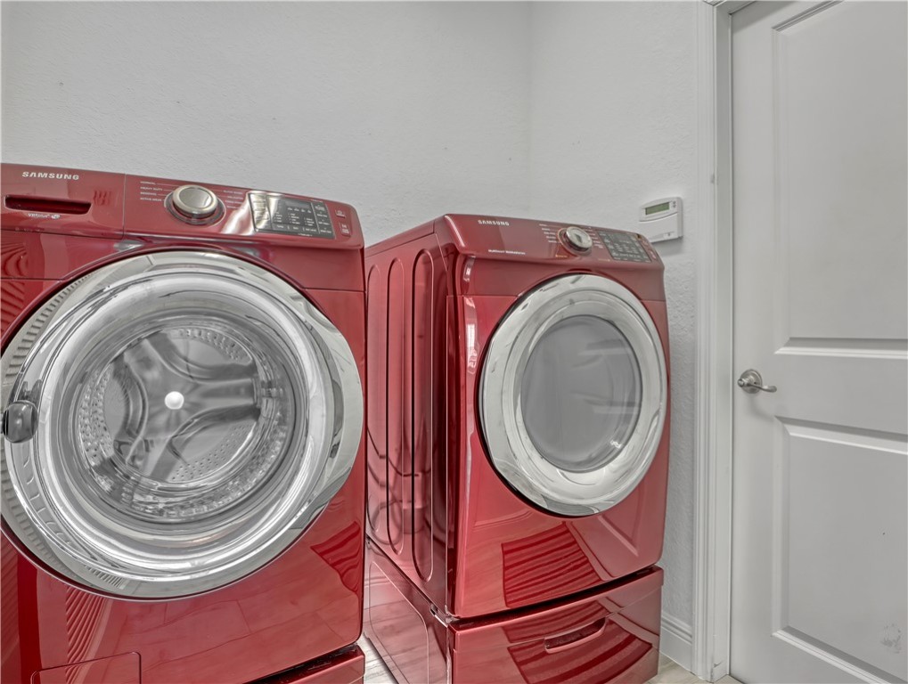 1756 Willows Square Vero Beach, FL 32966 - Photo 16 of 35 a utility room with dryer and washer