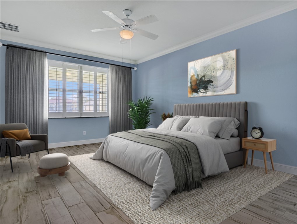 1756 Willows Square Vero Beach, FL 32966 - Photo 18 of 35 a spacious bedroom with a bed and wooden floor