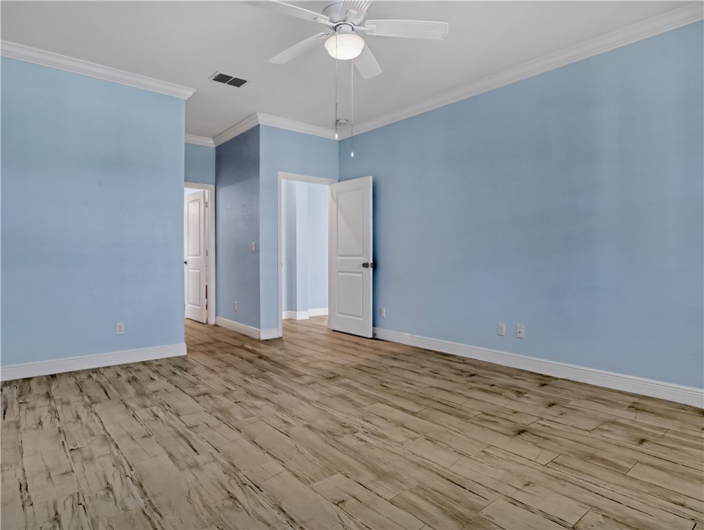 1756 Willows Square Vero Beach, FL 32966 - Photo 19 of 35 a view of an empty room with window and wooden floor