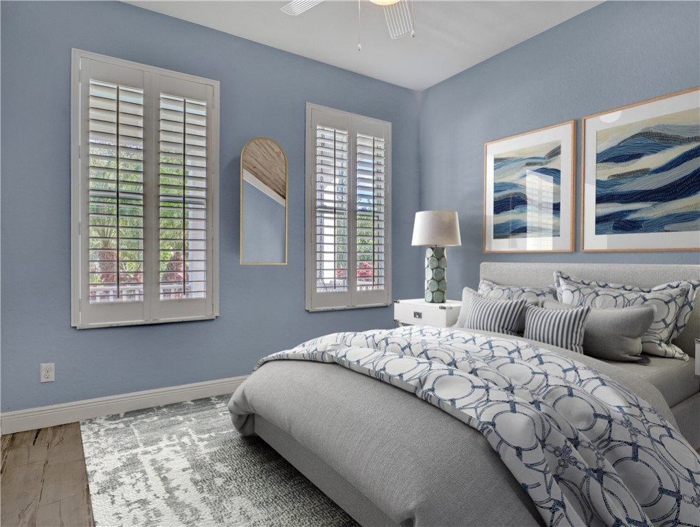 1756 Willows Square Vero Beach, FL 32966 - Photo 24 of 35 a bedroom with a bed and a window