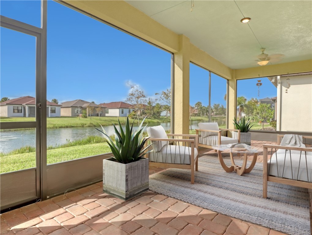 1756 Willows Square Vero Beach, FL 32966 - Photo 31 of 35 a living room with furniture floor to ceiling window and wooden floor