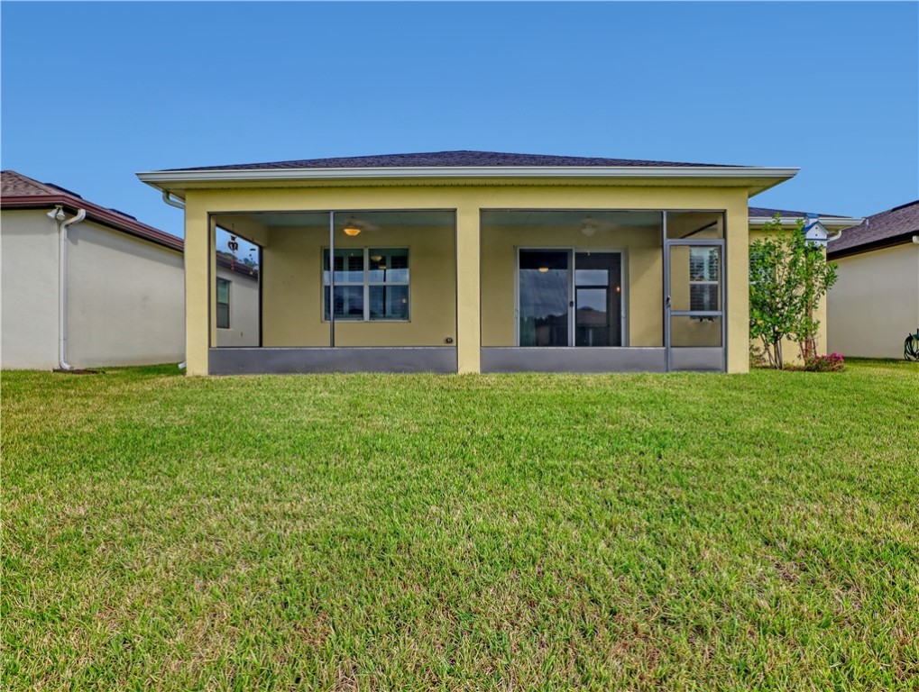 1756 Willows Square Vero Beach, FL 32966 - Photo 33 of 35 a view of a house with porch and garden