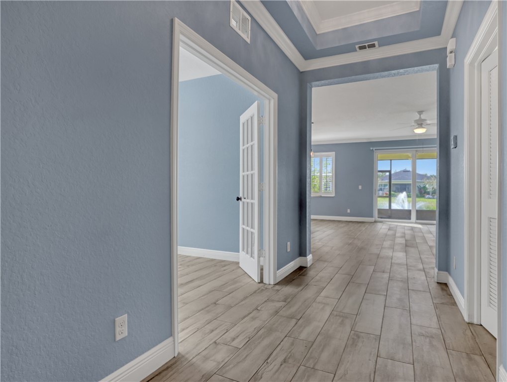 1756 Willows Square Vero Beach, FL 32966 - Photo 5 of 35 a view of a hallway with wooden floor