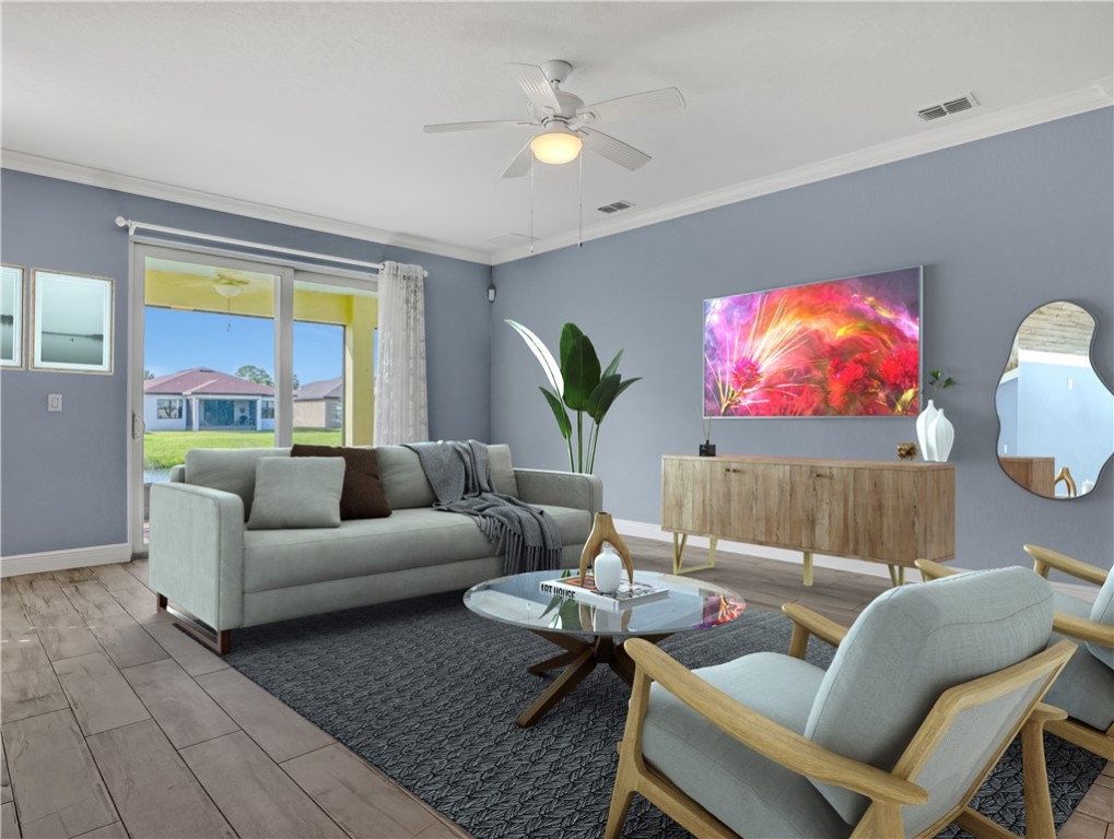 1756 Willows Square Vero Beach, FL 32966 - Photo 7 of 35 a living room with furniture potted plant and a window