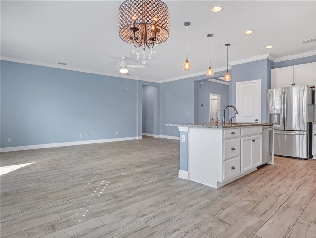 1756 Willows Square Vero Beach, FL 32966 - Photo 10 of 35 a kitchen with kitchen island stainless steel appliances a counter space and wooden floor
