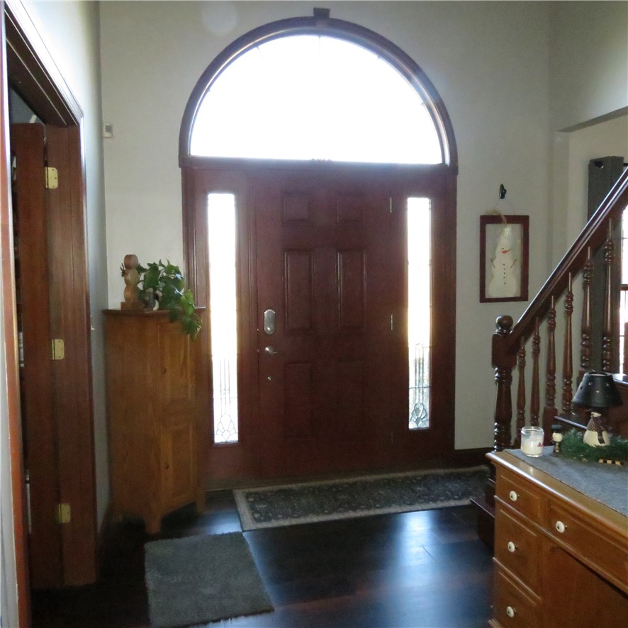10160 Lochard Road Sidney, OH 45365 - Photo 3 of 41 An inviting entryway with a grand door and sidelights creates a warm welcome.