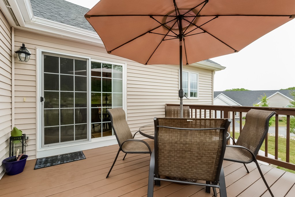 124 Quarry Road, Unit 124 Northbridge, MA 01588 - Photo 24 of 30 a view of a chairs and table in the balcony