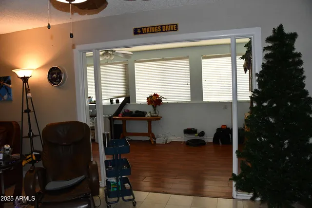 a room with gym equipment and a large window