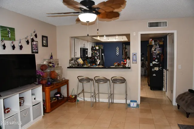 a view of a kitchen with furniture and chandelier