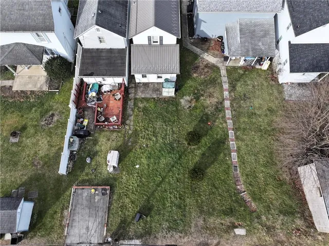 an aerial view of houses with outdoor space