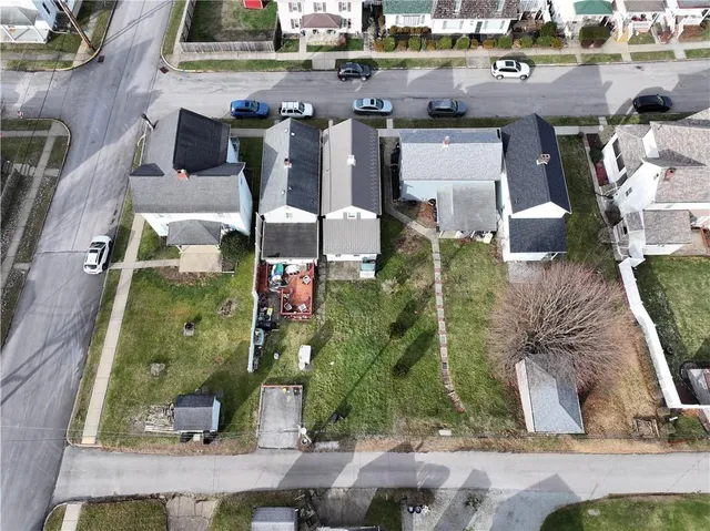 an aerial view of houses with outdoor space
