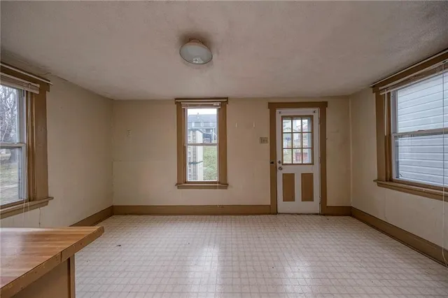 an empty room with windows