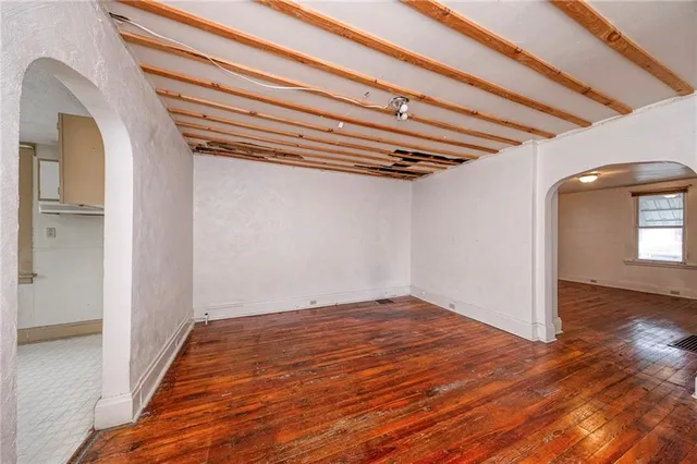 a view of a room with wooden floor