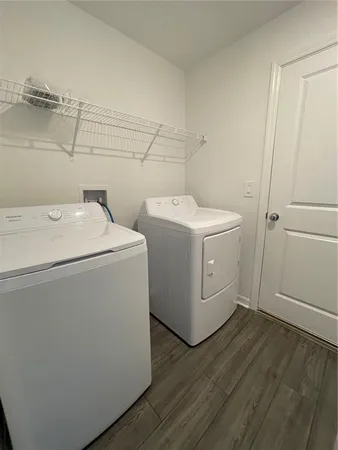 a utility room with dryer and washer