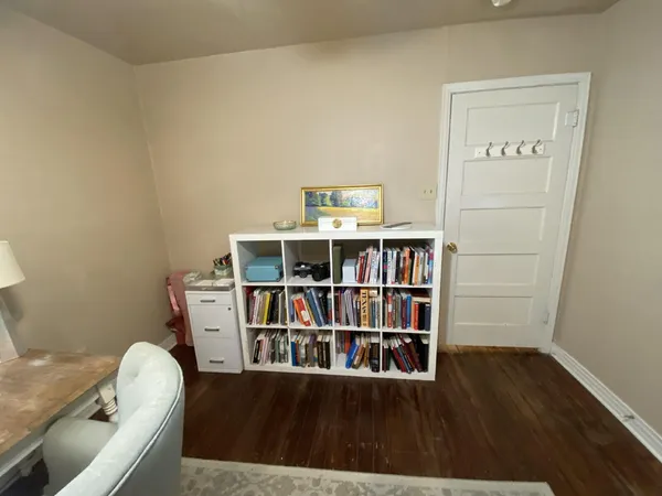 a room with furniture and wooden floor