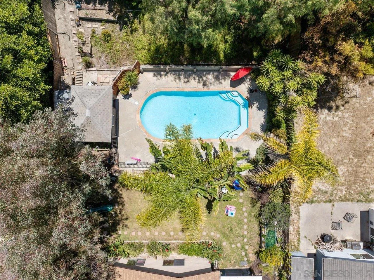2337 Fallingleaf Road Oceanside, CA 92056 - Photo 4 of 34 an aerial view of a house with a yard and a swimming pool