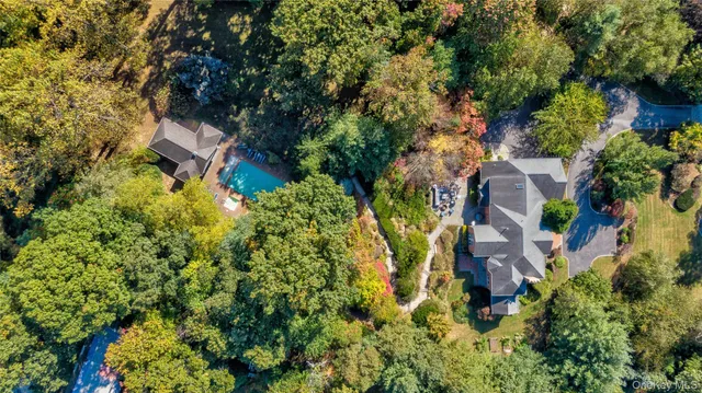 an aerial view of a house with a yard