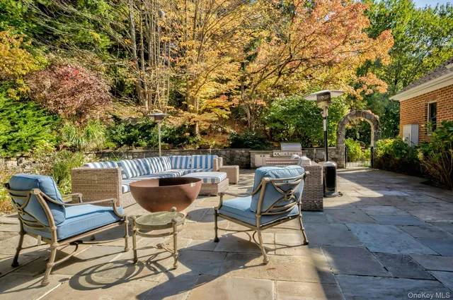 a view of a chairs and table in the patio