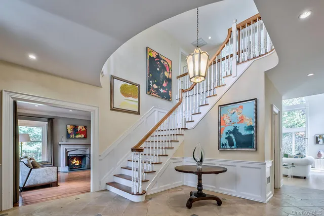 a view of entryway and hall with dining area