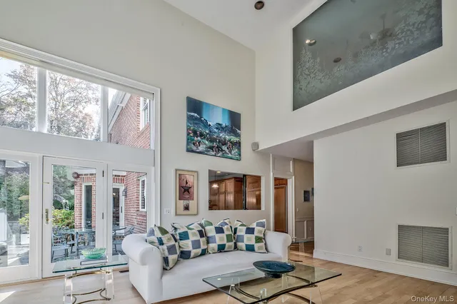 a living room with furniture and large window