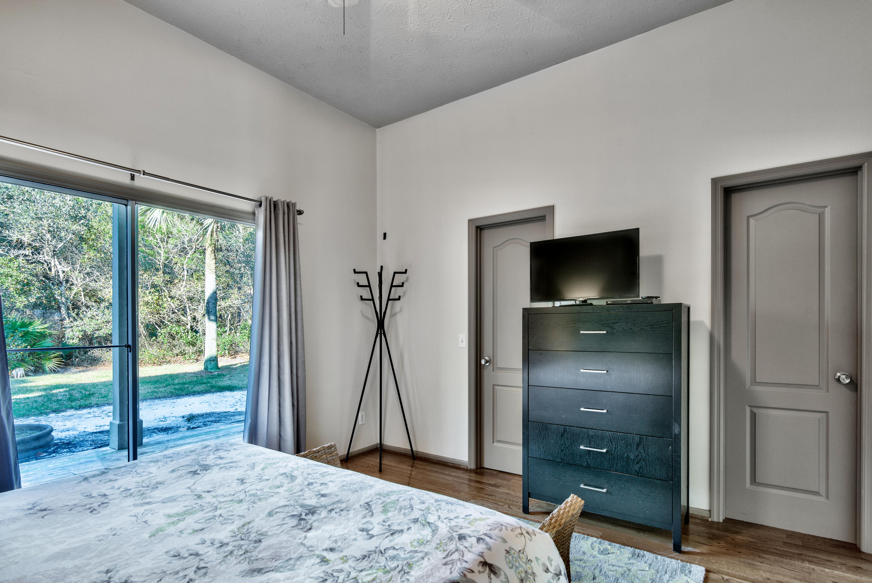 178 Pelican Circle Inlet Beach, FL 32461 - Photo 22 of 61 a bedroom with a bed and a flat tv screen