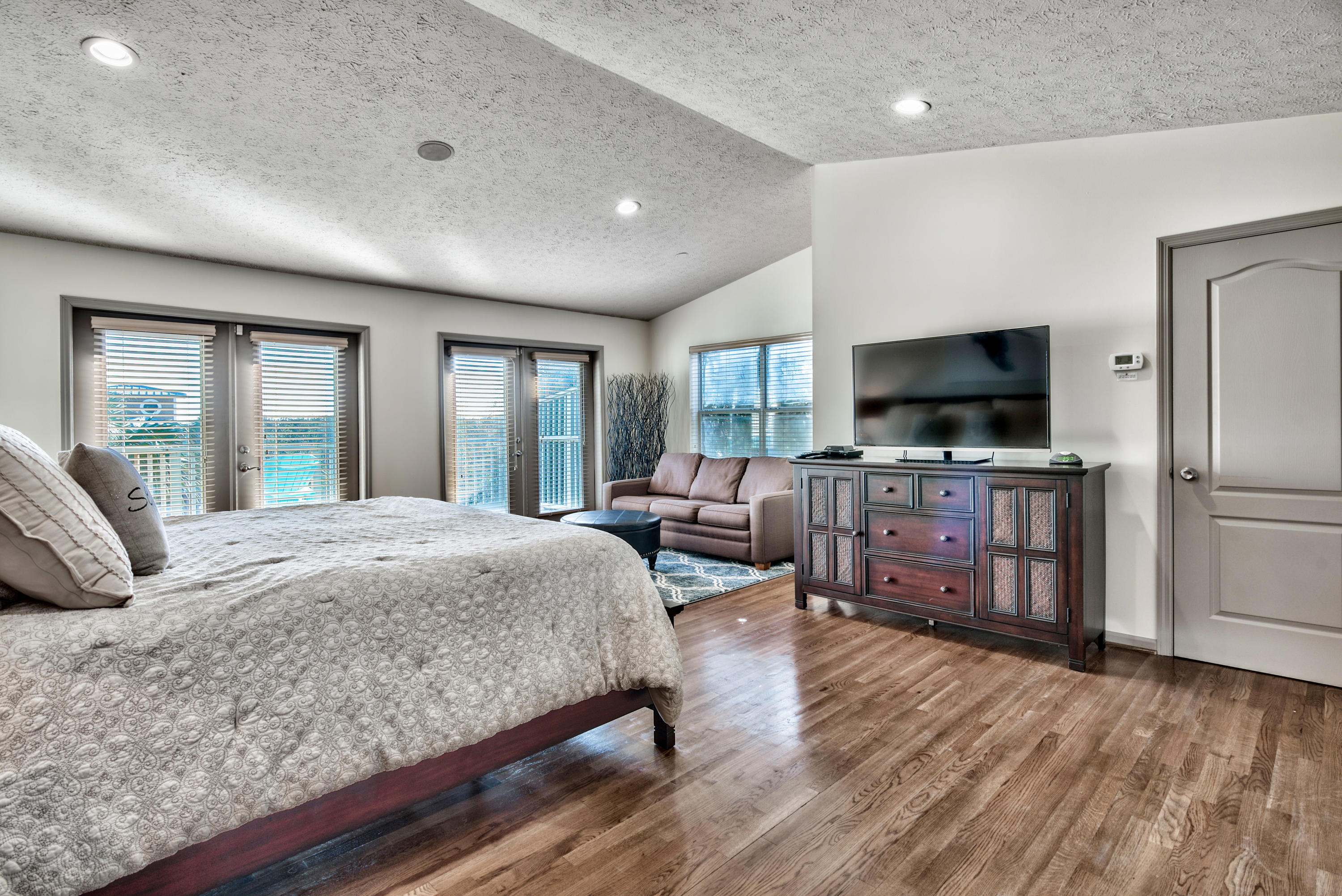 178 Pelican Circle Inlet Beach, FL 32461 - Photo 27 of 61 a bedroom with a bed flat screen tv and windows