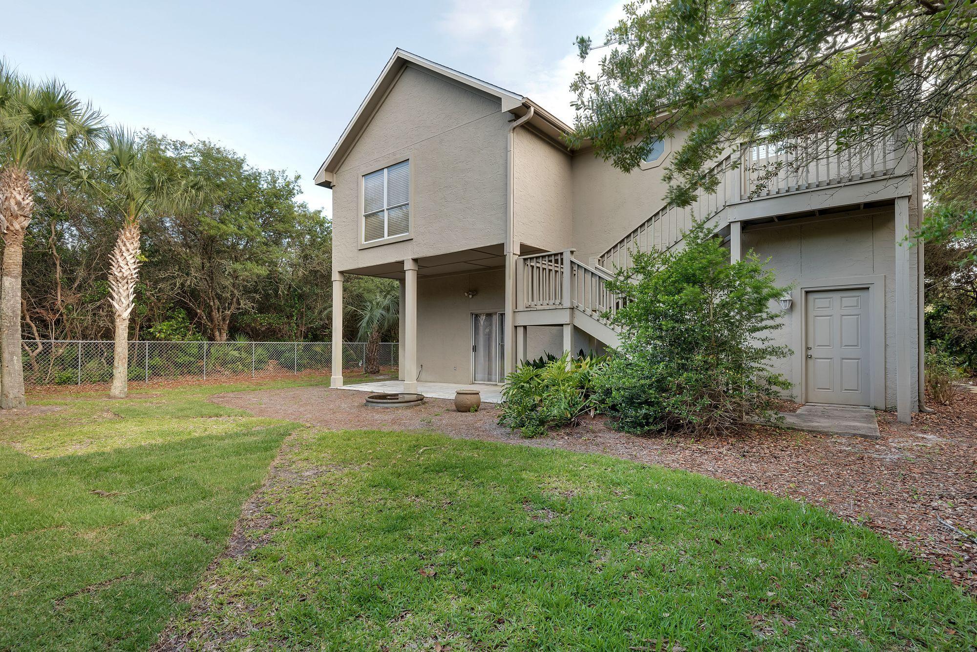 178 Pelican Circle Inlet Beach, FL 32461 - Photo 42 of 61 a view of a house with backyard and garden