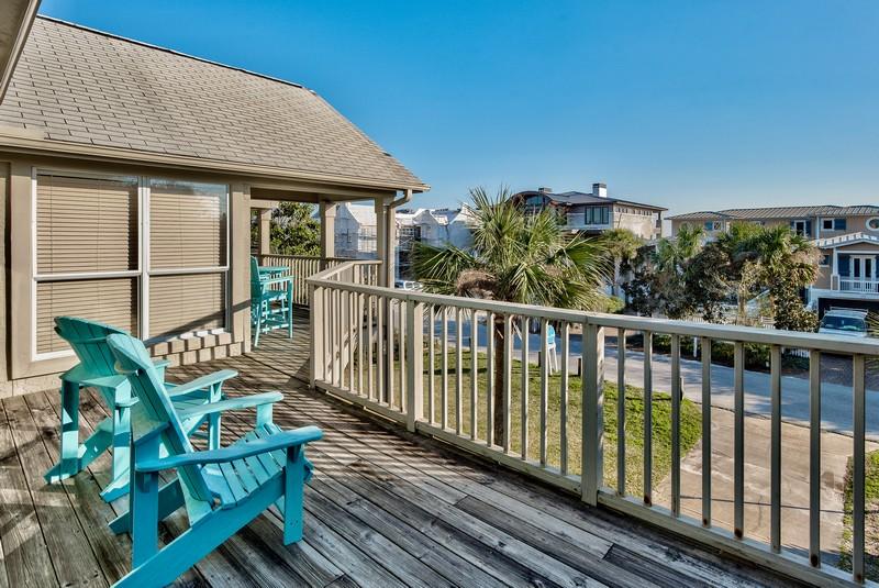 178 Pelican Circle Inlet Beach, FL 32461 - Photo 5 of 61 a balcony with wooden floor outdoor seating and yard in the back