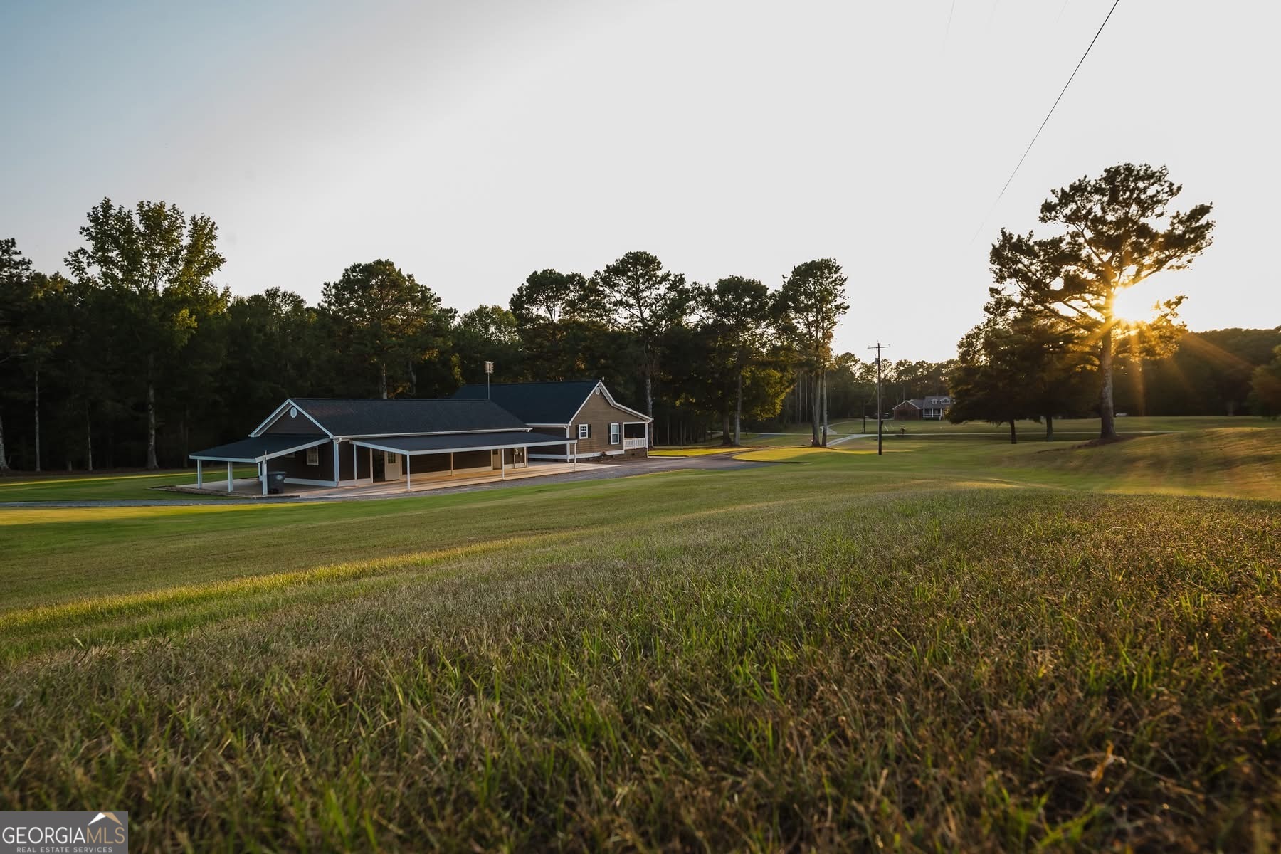 410 Country Kitchen Road Barnesville, GA 30204 - Photo 102 of 120 a front view of a house with a yard and trees